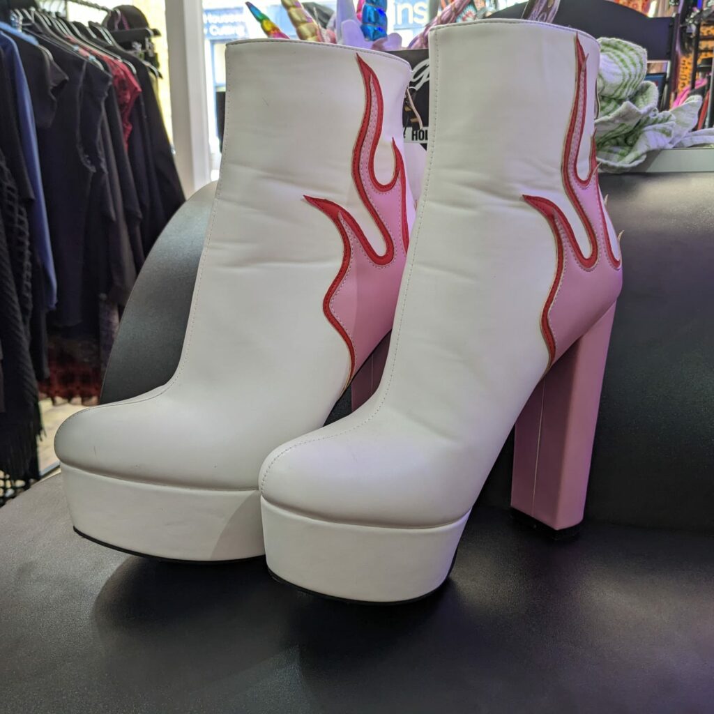 white and pink flame boots